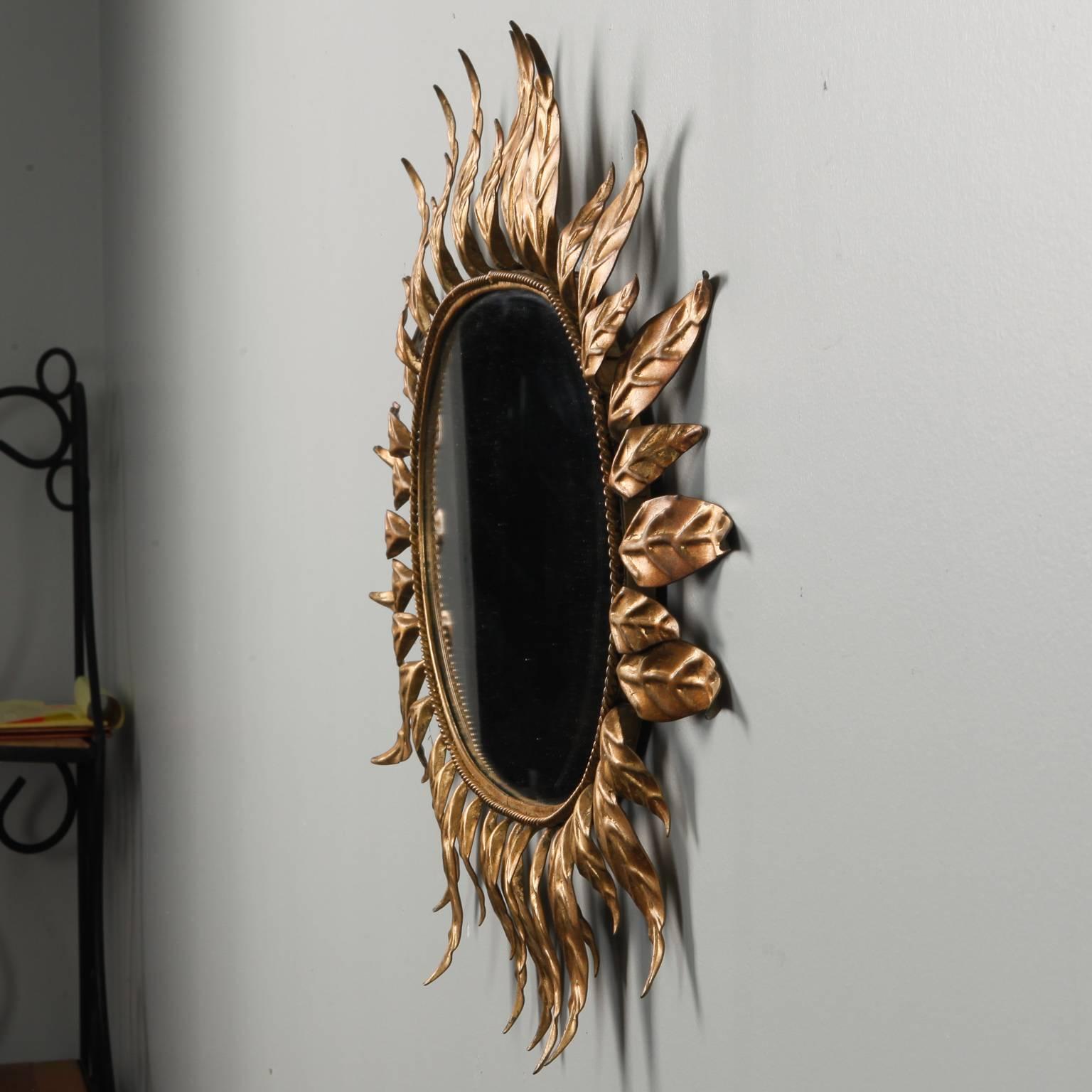 Spanish Midcentury Oval Mirror with Gilded Leaf Form Sunburst Frame