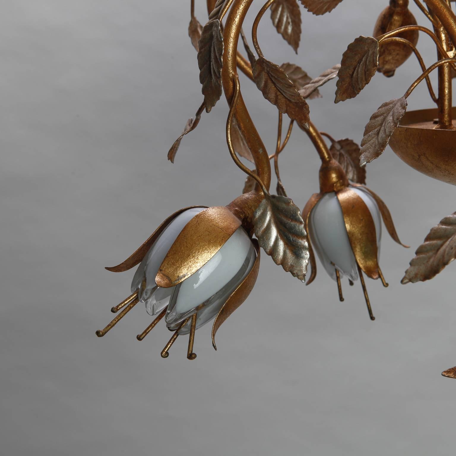 Silver gilt shaft, gold tole leaves and flowers. Tulip petals are made of handblown clear and white glass. Each bloom has a candelabra socket - nine total.
