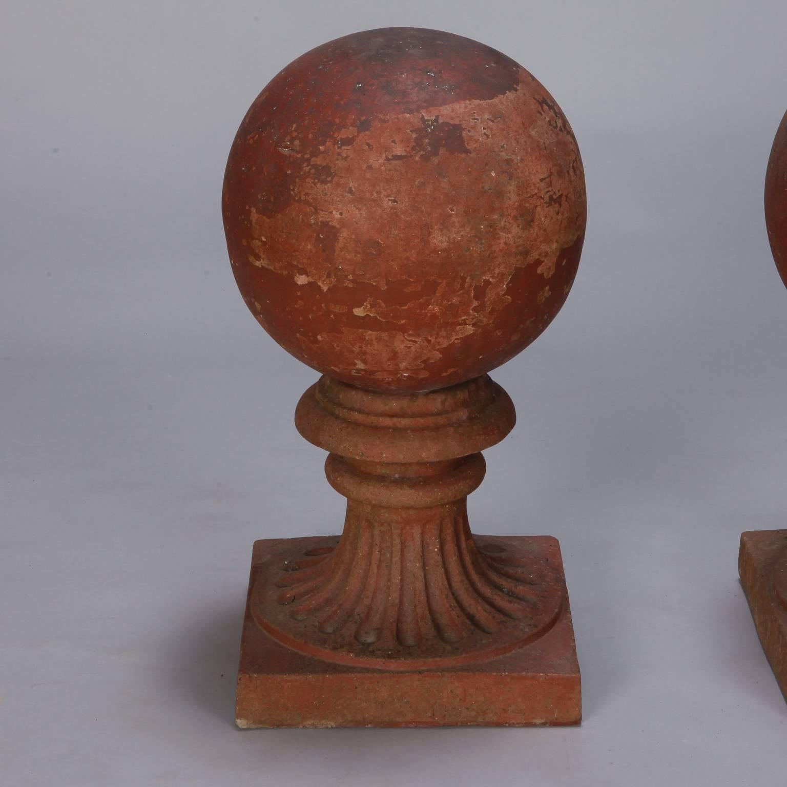 Large terra cotta round finial on pedestal base, circa 1930s. Salvaged from an outdoor European structure with expected wear and patina to surface. Sold and priced individually. Two available.

   