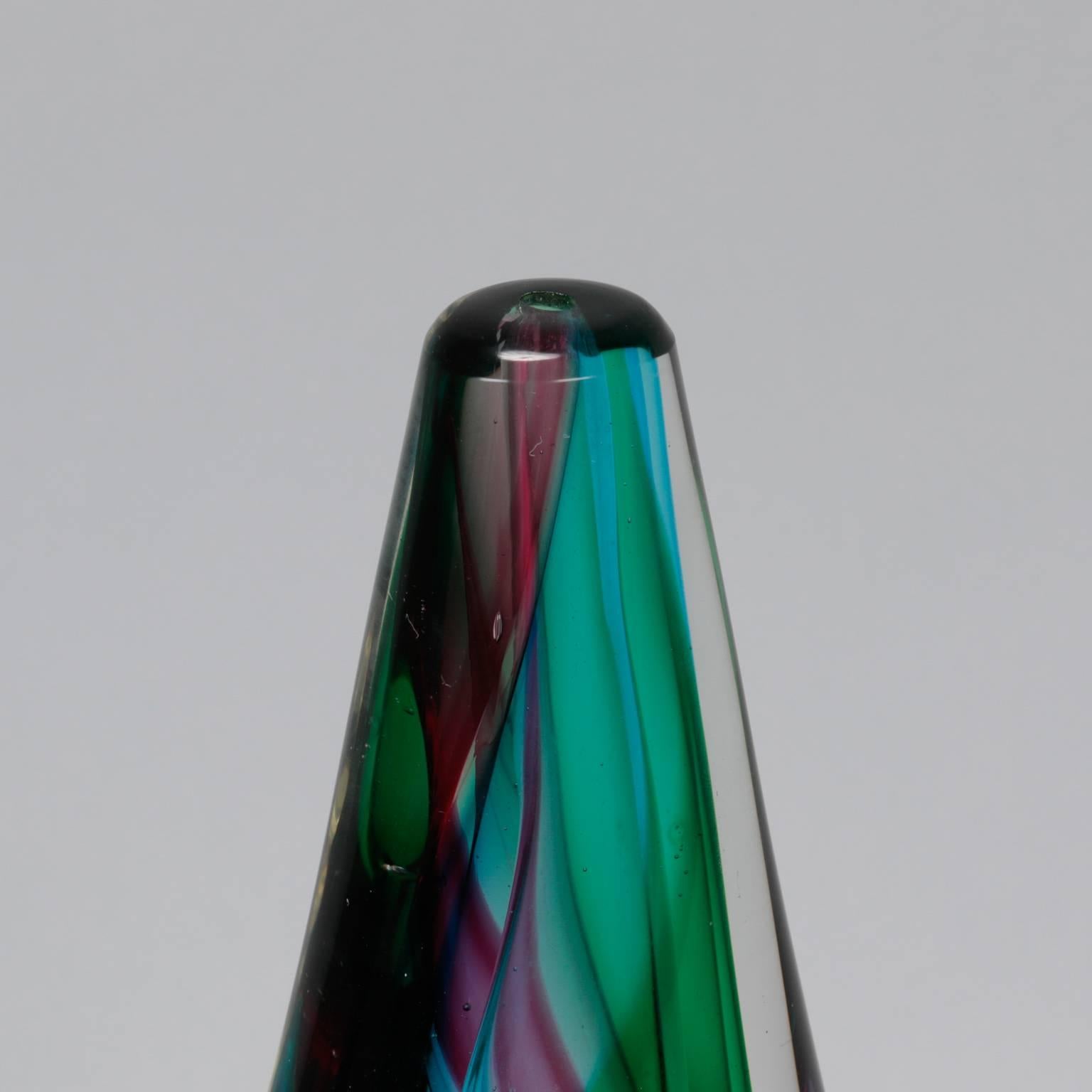 Tall Murano sculpted vase with clear, twisted outer form and a core of twisted wide bands of multi-color glass, circa 1960s. Unsigned, unknown maker.
 
