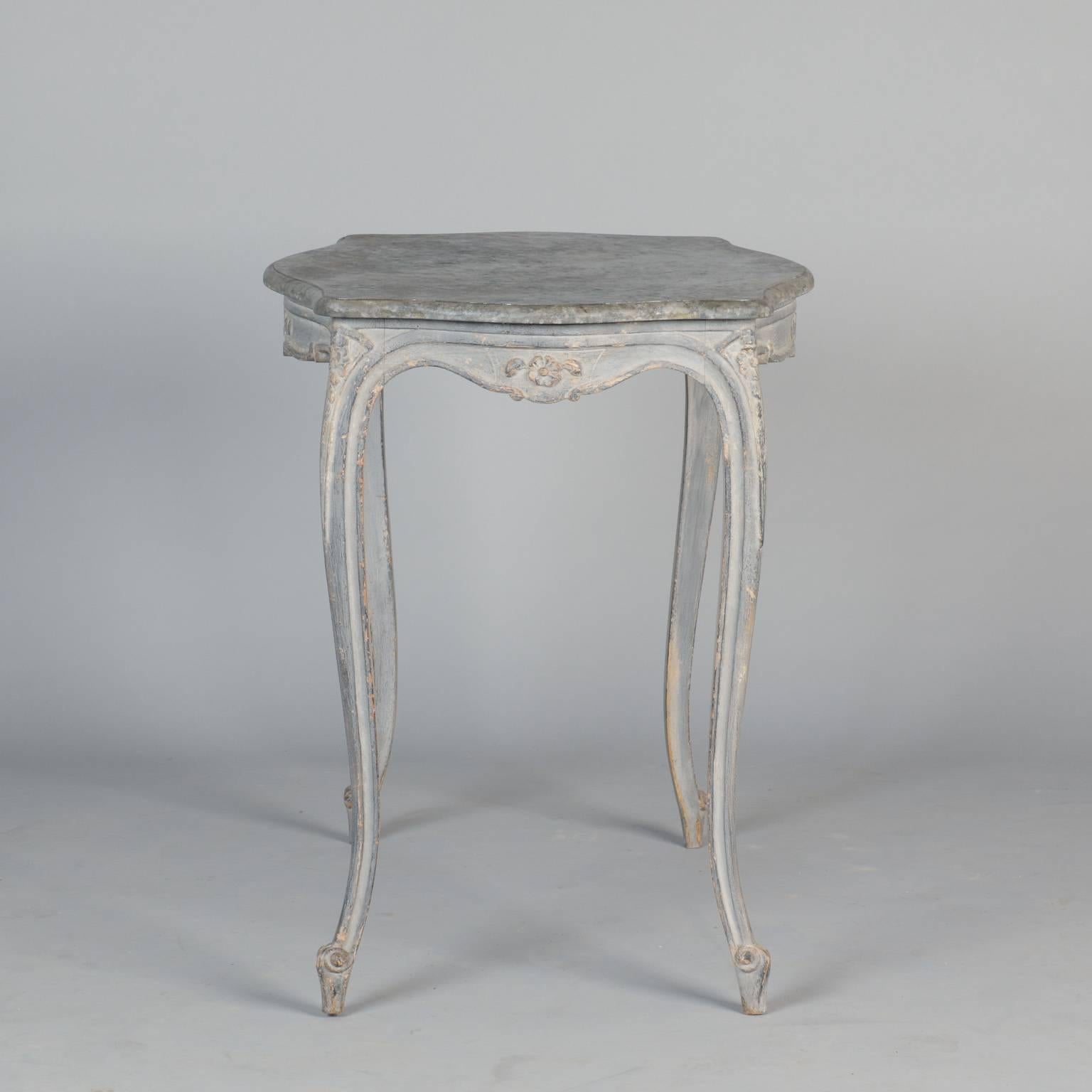 French side table features carved details on the apron, knees and a pale blue painted finish, circa 1920s.