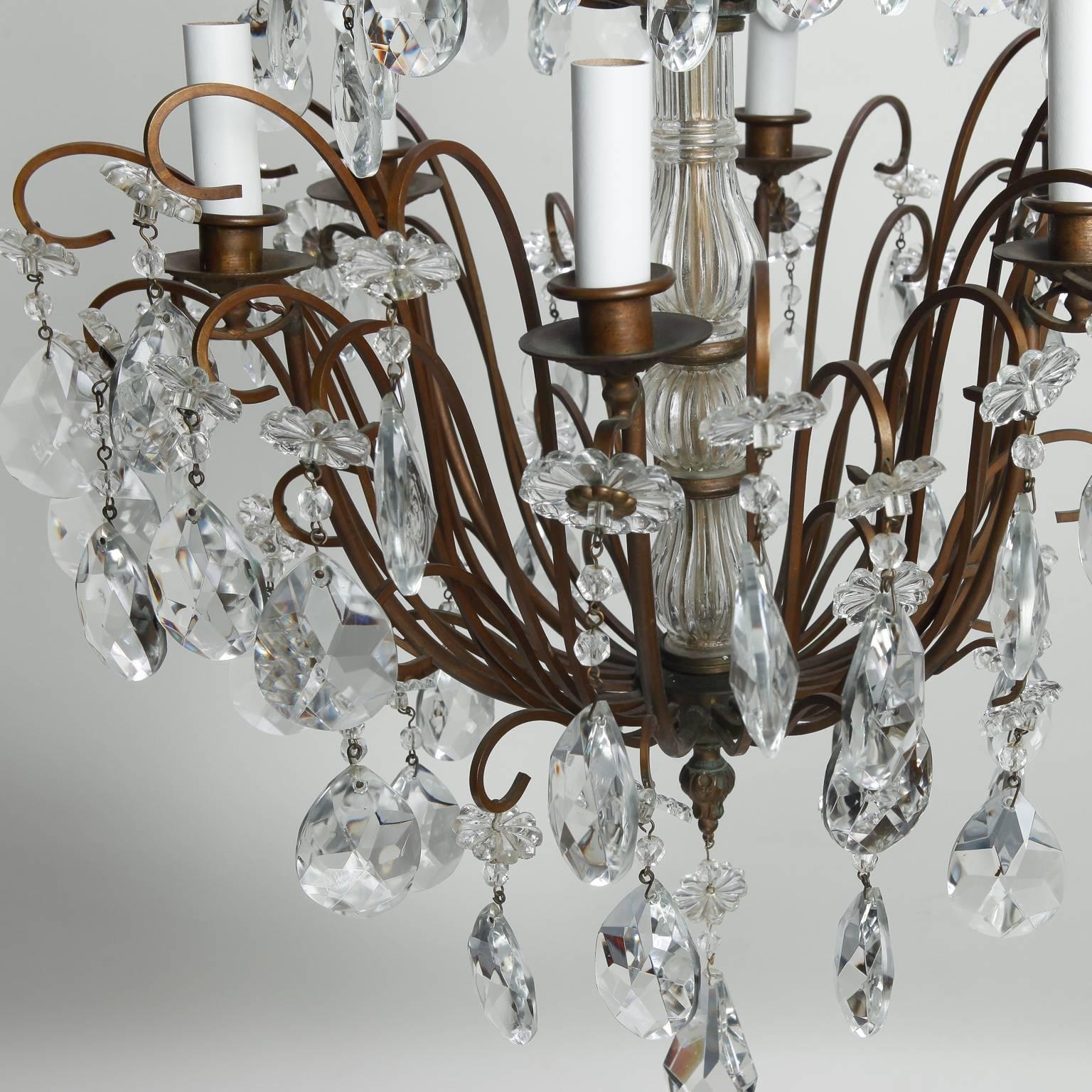 Tall, Italian six-light chandelier has a dark metal frame and three tiers of crystal pendants and large center drop, circa 1900. New wiring for US electrical standards.