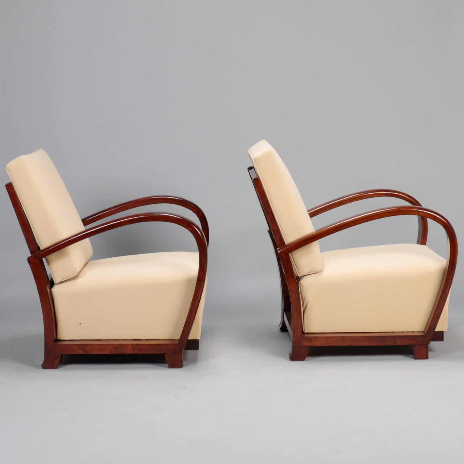 Polished Pair of Art Deco Chairs with Curved Palisander Arms