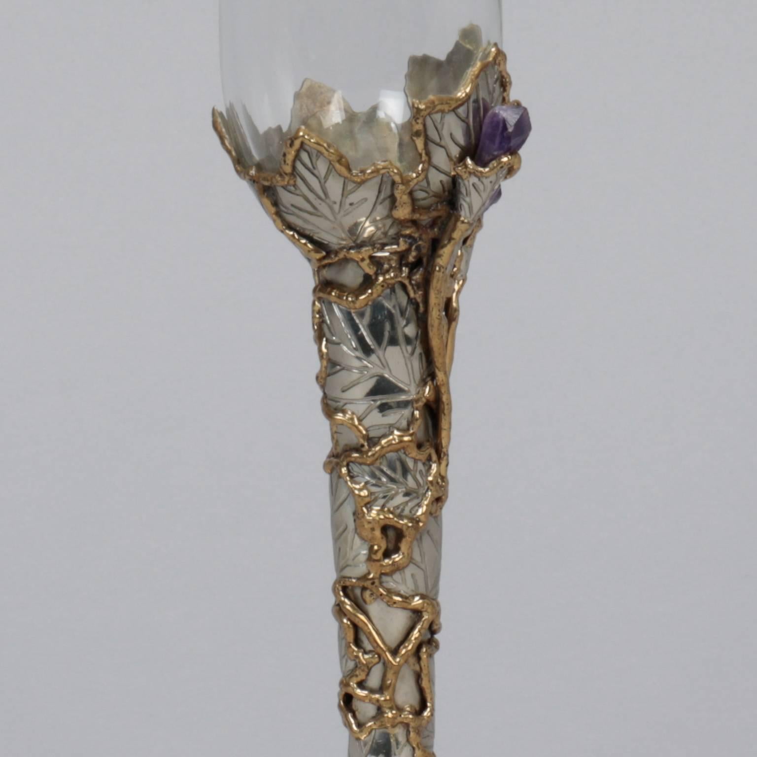 White wine glass with artisan made silver and gold tone metal surround with vines and leaves and amethyst crystal accents, circa 1980s. Glass has gold rim and piece is marked 