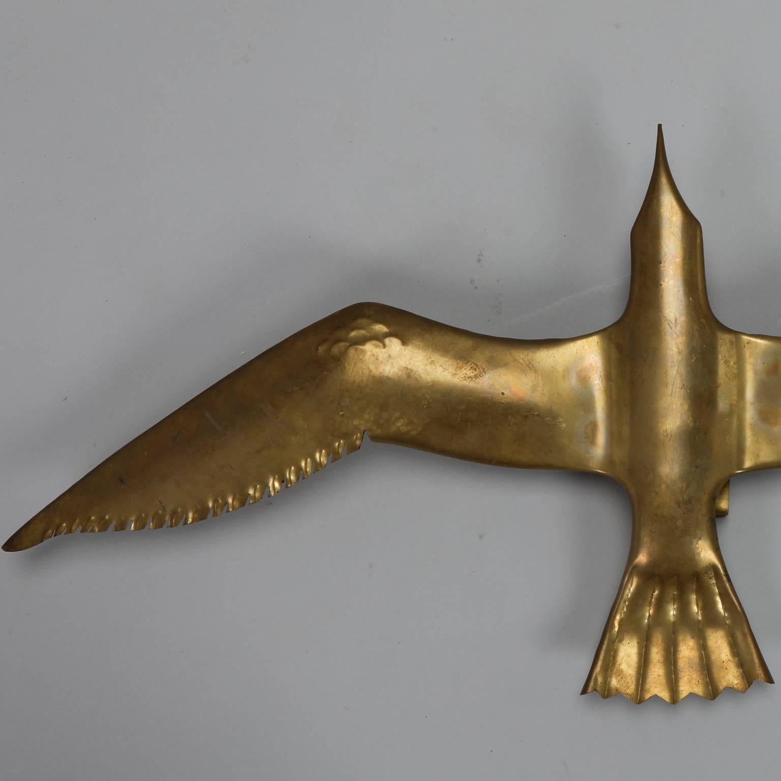 Found in Italy, this large polished brass seagull has a light socket that can be electrified for use as a sconce or leave it unwired and use as a wall-mounted sculpture. Three in this finish and size range available at the time of posting. Please