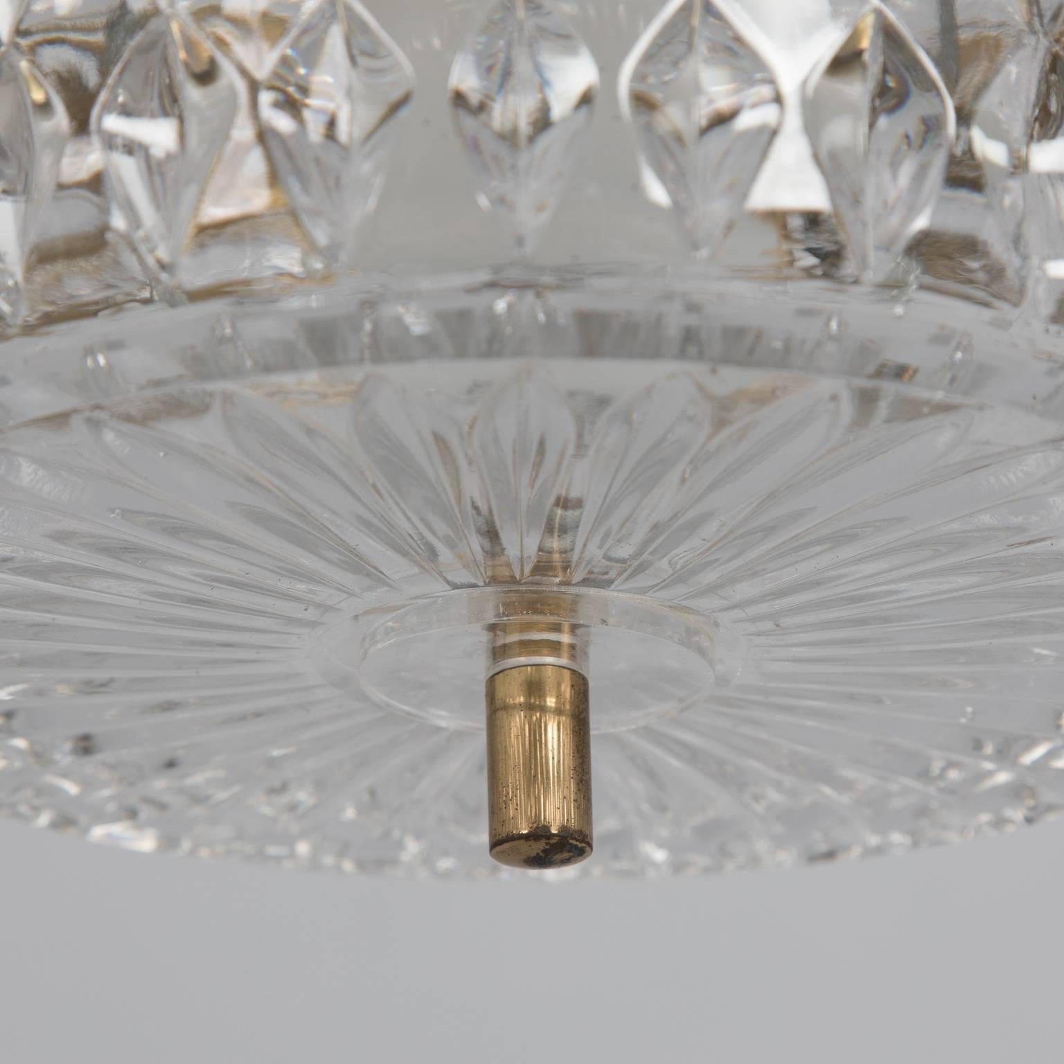 Clear crystal and brass pendant style light fixture by Kalmar, circa 1970s. New wiring for US electrical standards.
             