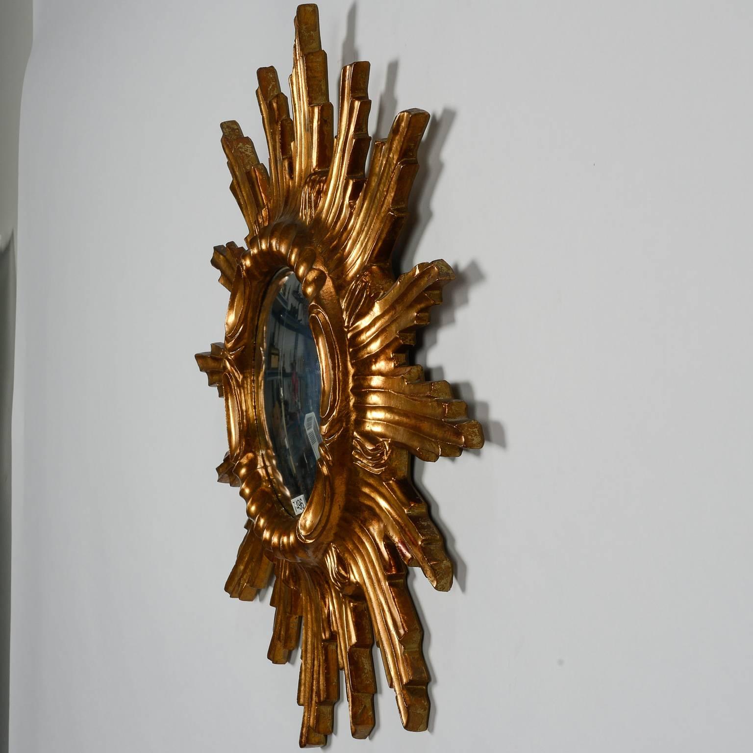 Mid-Century Spanish giltwood frame mirror in form of sunburst is 22” diameter and dates from the 1950s.