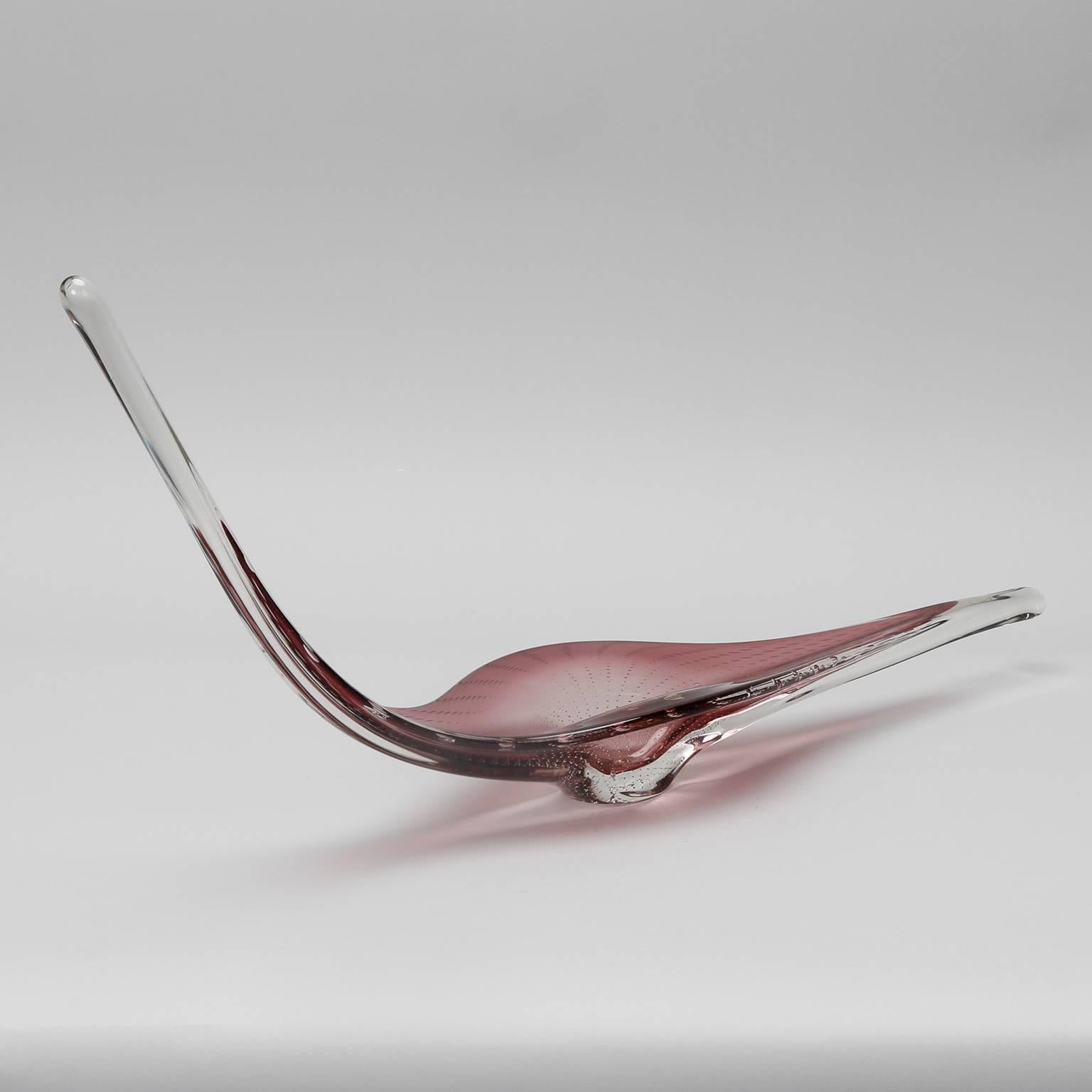 Art glass bowl with dramatic elongated and curved rim by Belgium firm Boussu, circa 1960s. Purple and clear handcrafted glass with bubbles in the base. Original (partial) label still affixed.
