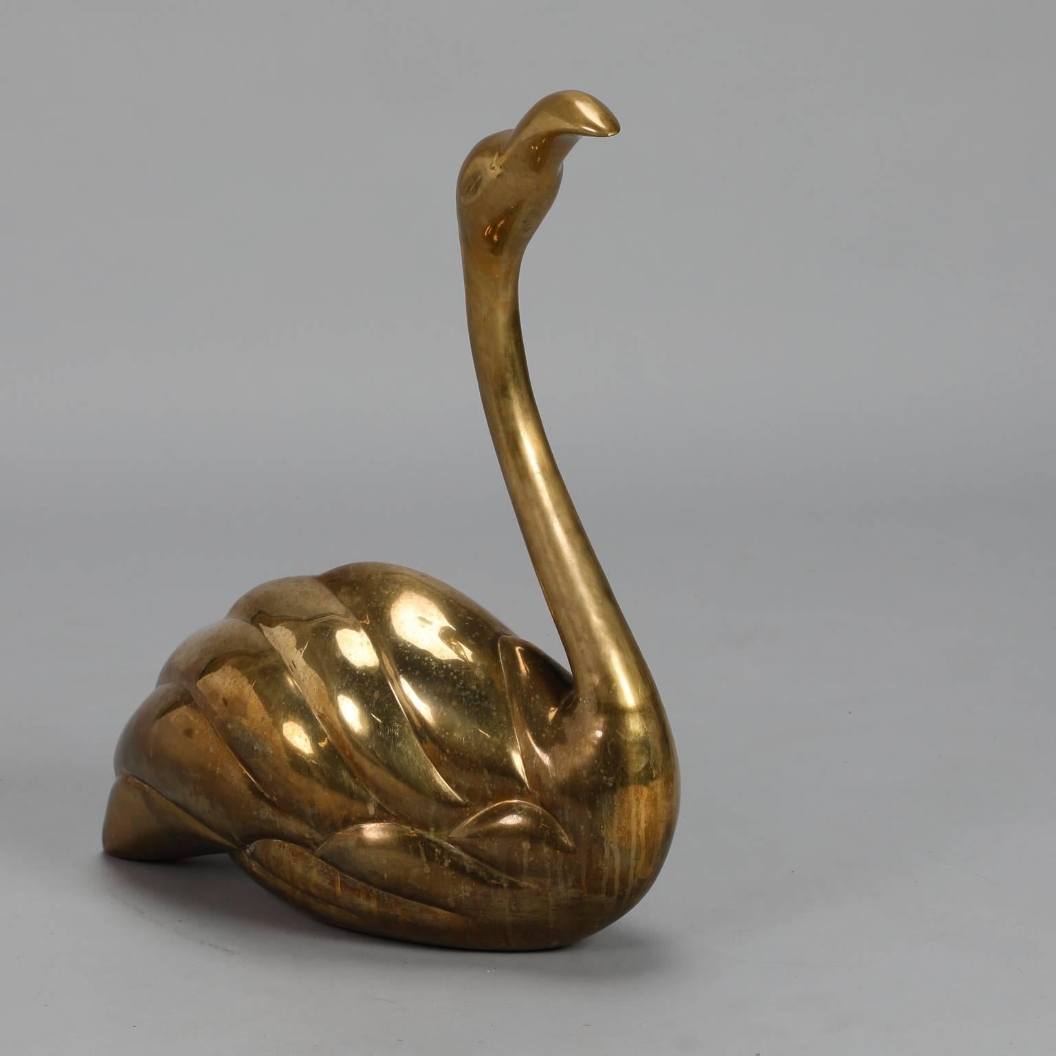 Spanish large solid brass seated or floating flamingo, circa 1970s. Sits nicely on a table or shelf and is two feet tall as shown. Unknown maker.
  