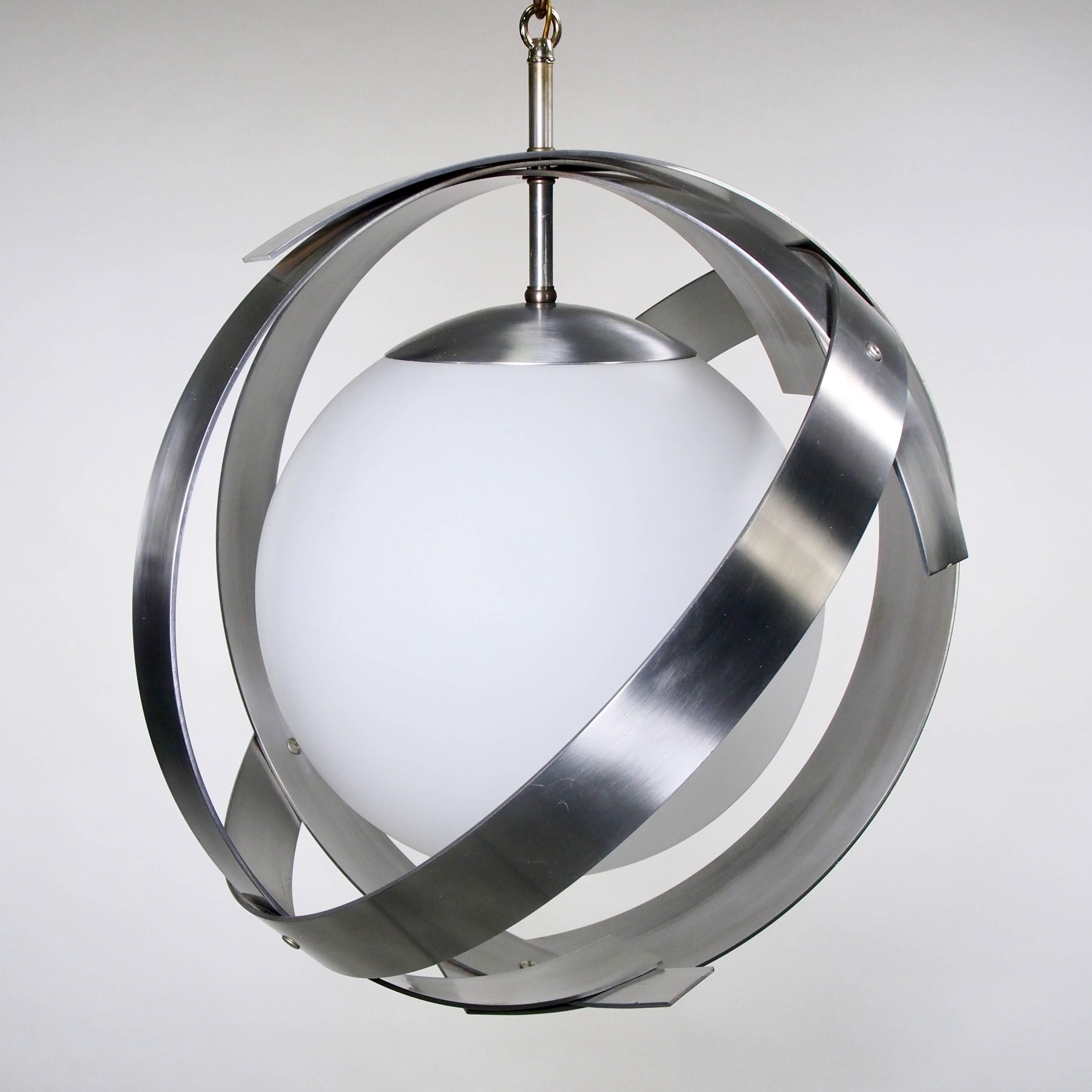 Laurel C-1126 pendant light fixtures from the 1974 Laurel catalog feature brushed aluminum open work surrounds with large white glass globes. Excellent vintage condition. Sold and priced as a pair. 