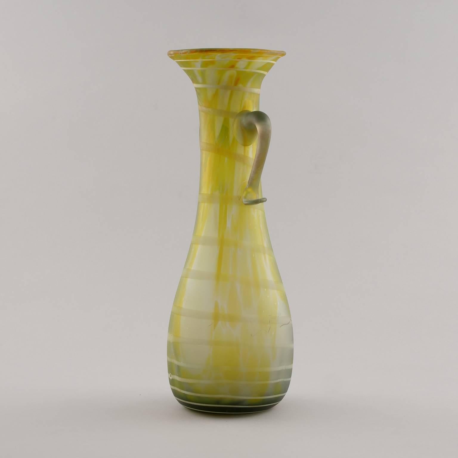 Spring green Italian mouth blown glass vase with handles on neck and subtle white stripes, circa 1970s. Two available in this style. Sold and priced individually.
