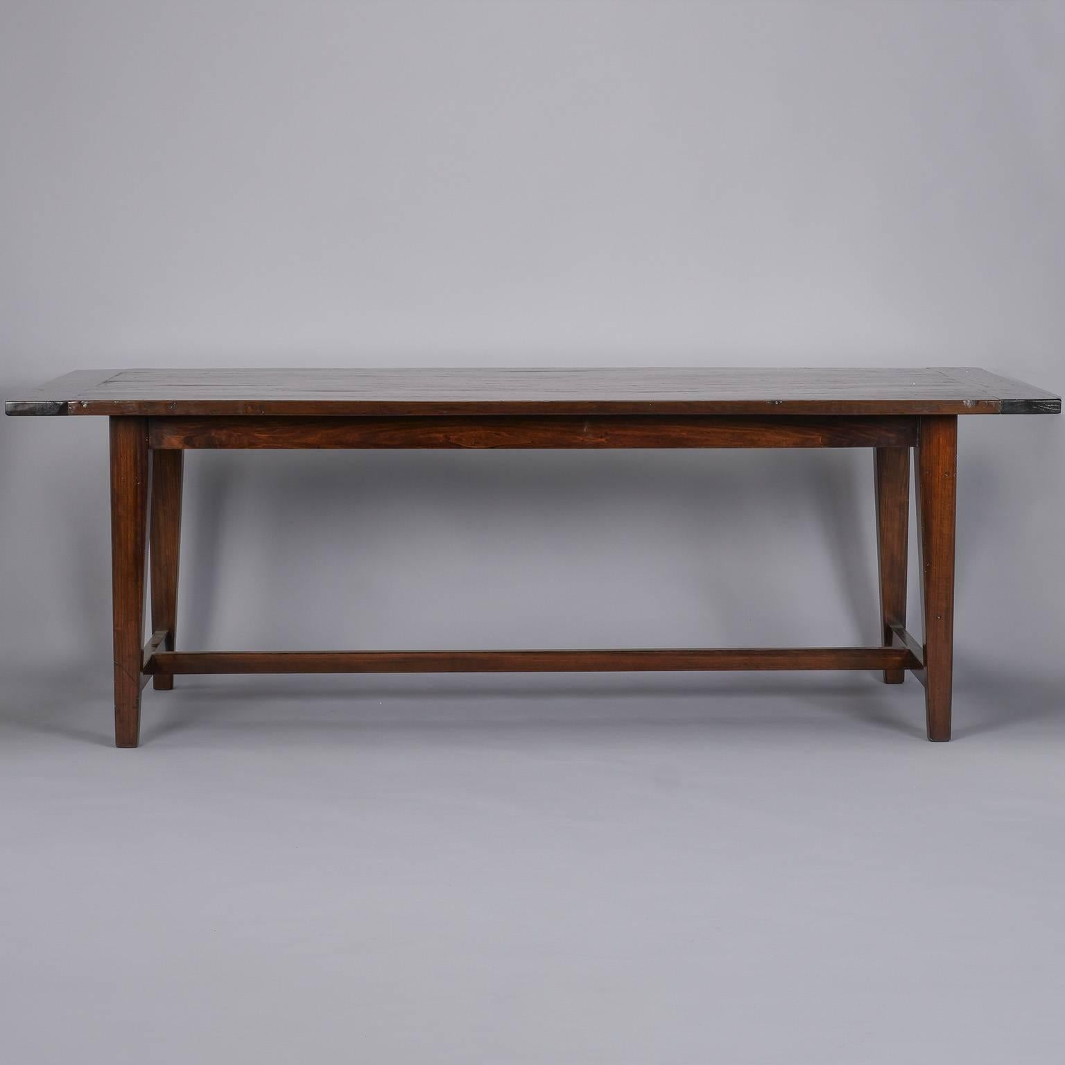 French chestnut tabletop on new legs, circa 1860s. Beautiful wear and patina to the solid chestnut farm tabletop which is supported by new, solid wood legs with a subtle taper, centre and side stretchers.  Table apron height = 25.5