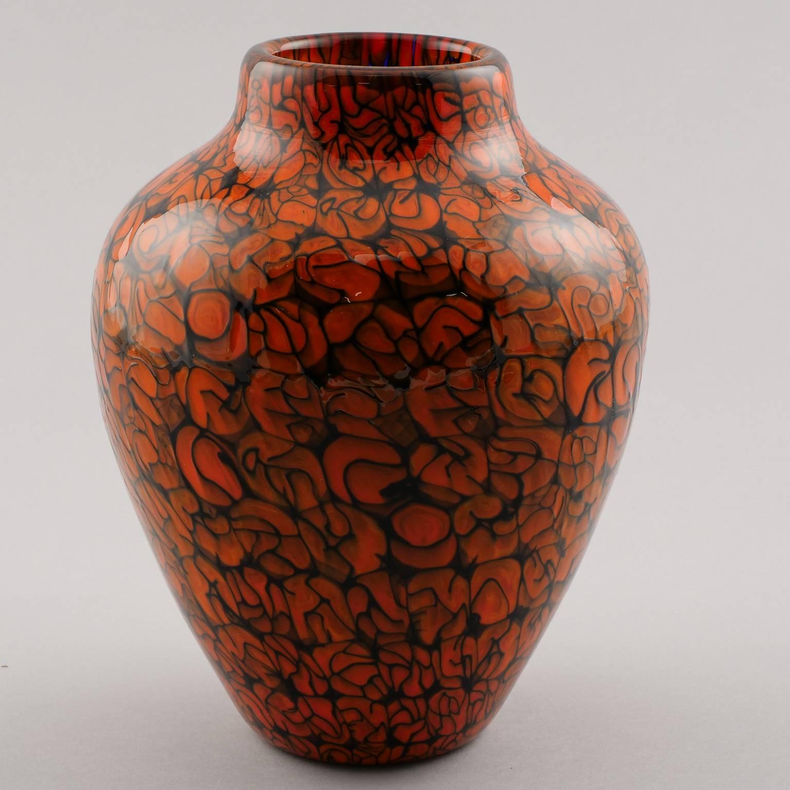 Classic form Murano glass vase by artist Marino Santi for Eugenio Ferro & Co, circa 2013. Vibrant shades of orange red and black. Engraved signature by the artist on underside, original card from manufacturer. New condition with no flaws found.