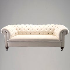 Late 19th Century Chesterfield Sofa with Turned Mahogany Legs and New Upholstery