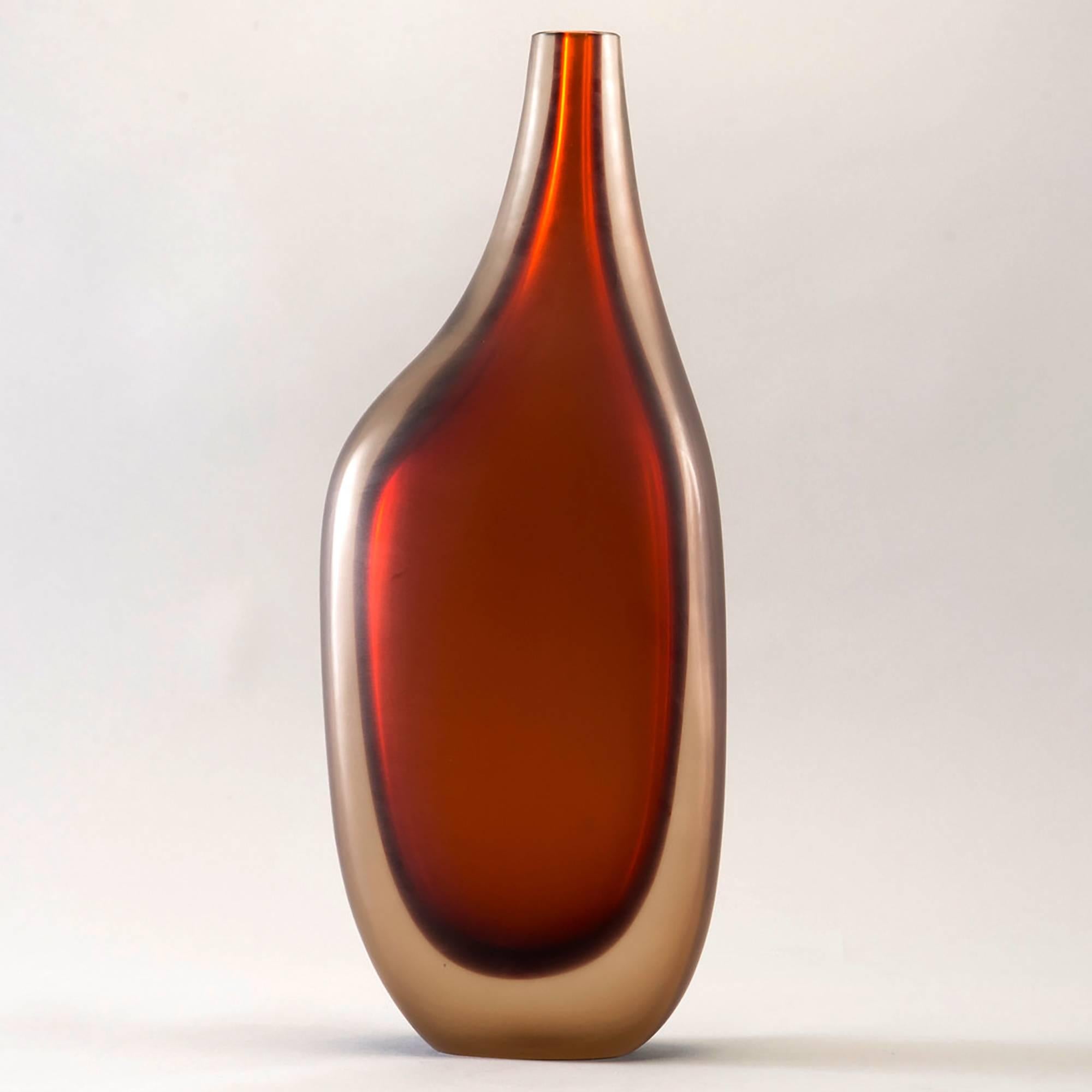 Limited edition handcrafted vase in rich rust red colored cased glass, circa 2017. Designed by Ivan Baj at Arcade, this piece has a sensual biomorphic shape and is signed by the artist and numbered 26 of 33. New condition with no flaws found.
   