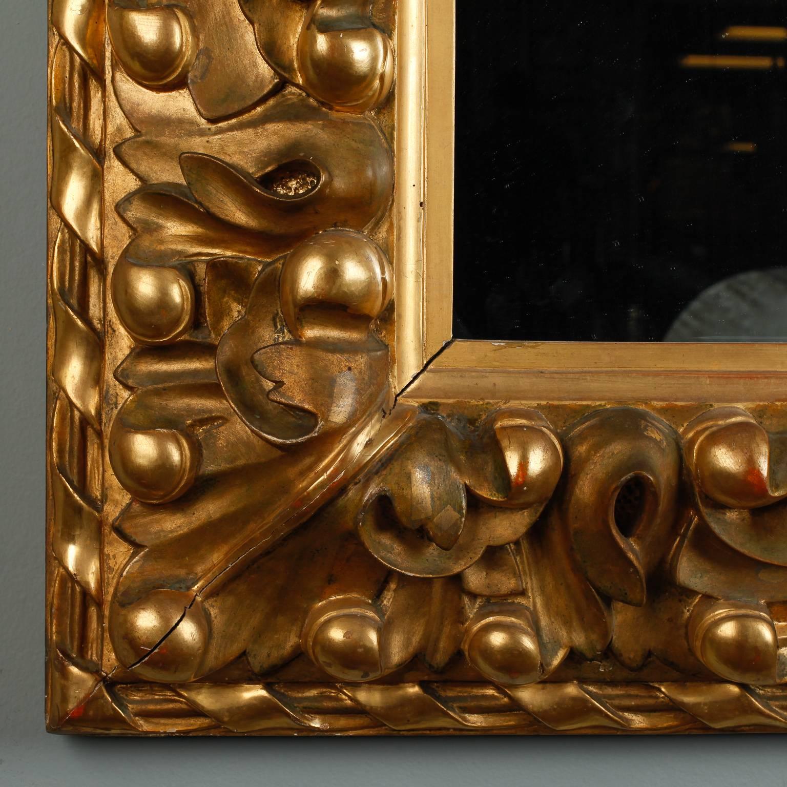 Gesso 19th Century Italian Mirror with Deeply Carved Gilded Frame