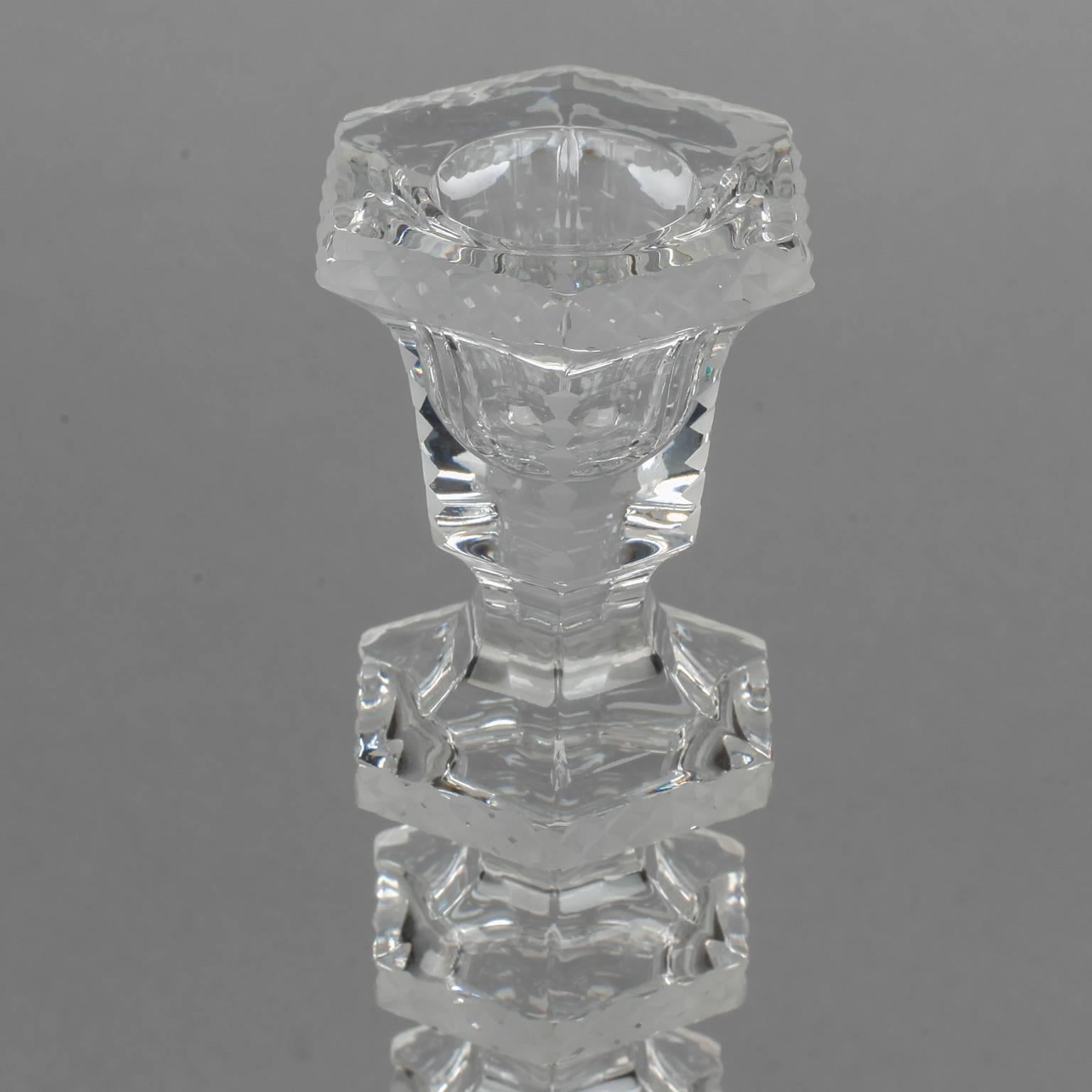 4298, pair of finely cut crystal candlesticks.

Pair of circa 1950s clear cut crystal candlesticks found in Belgium with column of graduated crystal knobs. Decorative etched details in contrasting satin finish along the edges. Sold and priced as a