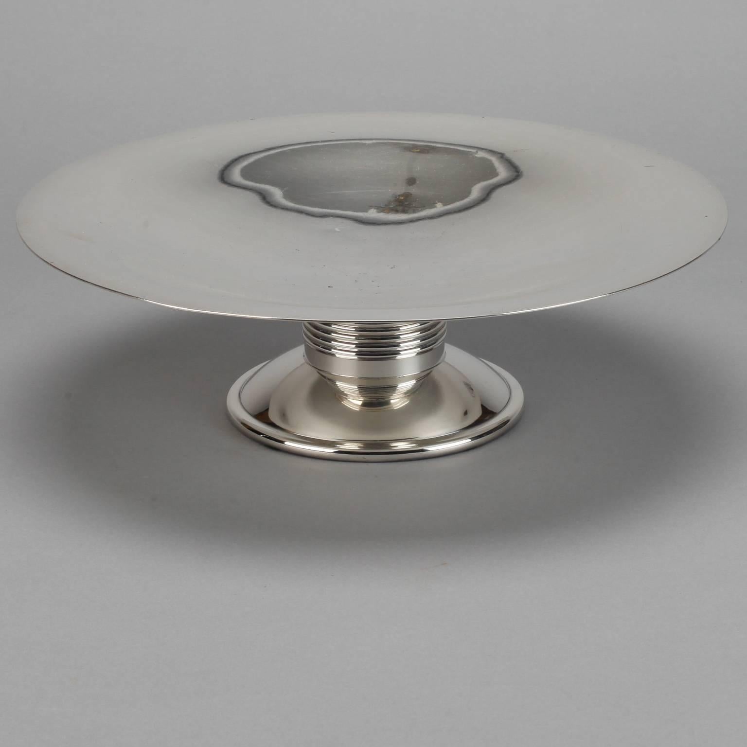 Found in England, this midcentury silver plate tazza has a Classic shape and finely reeded center support.