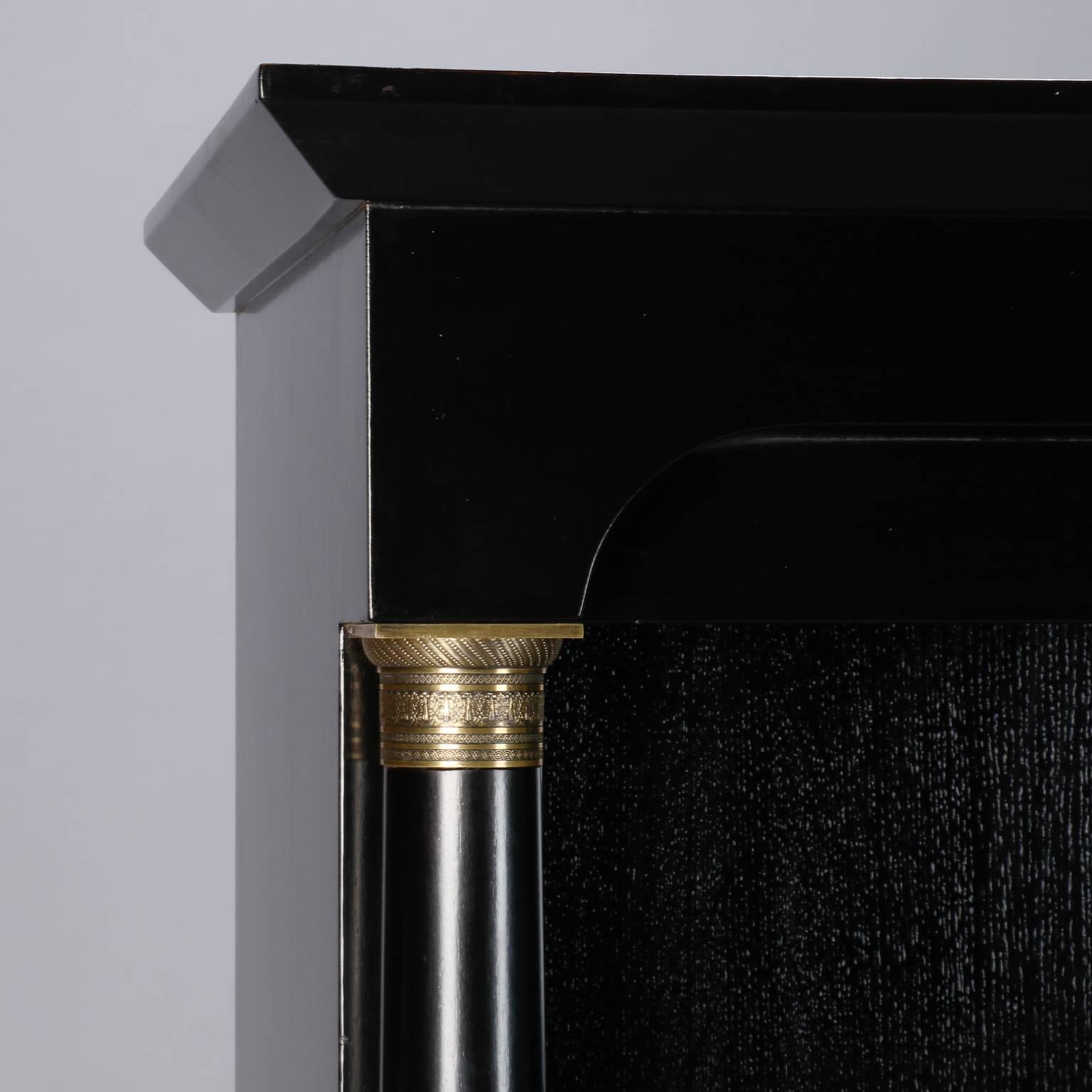 Cast Empire Style Bookcase with Ebonized Finish and Brass Trim