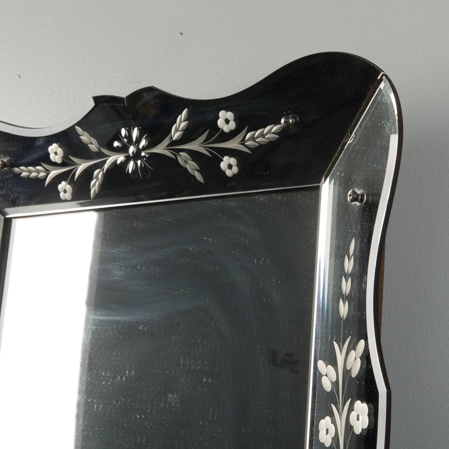 Rectangular Venetian mirror has a scalloped edge frame with etched floral details, circa 1930s. 

              