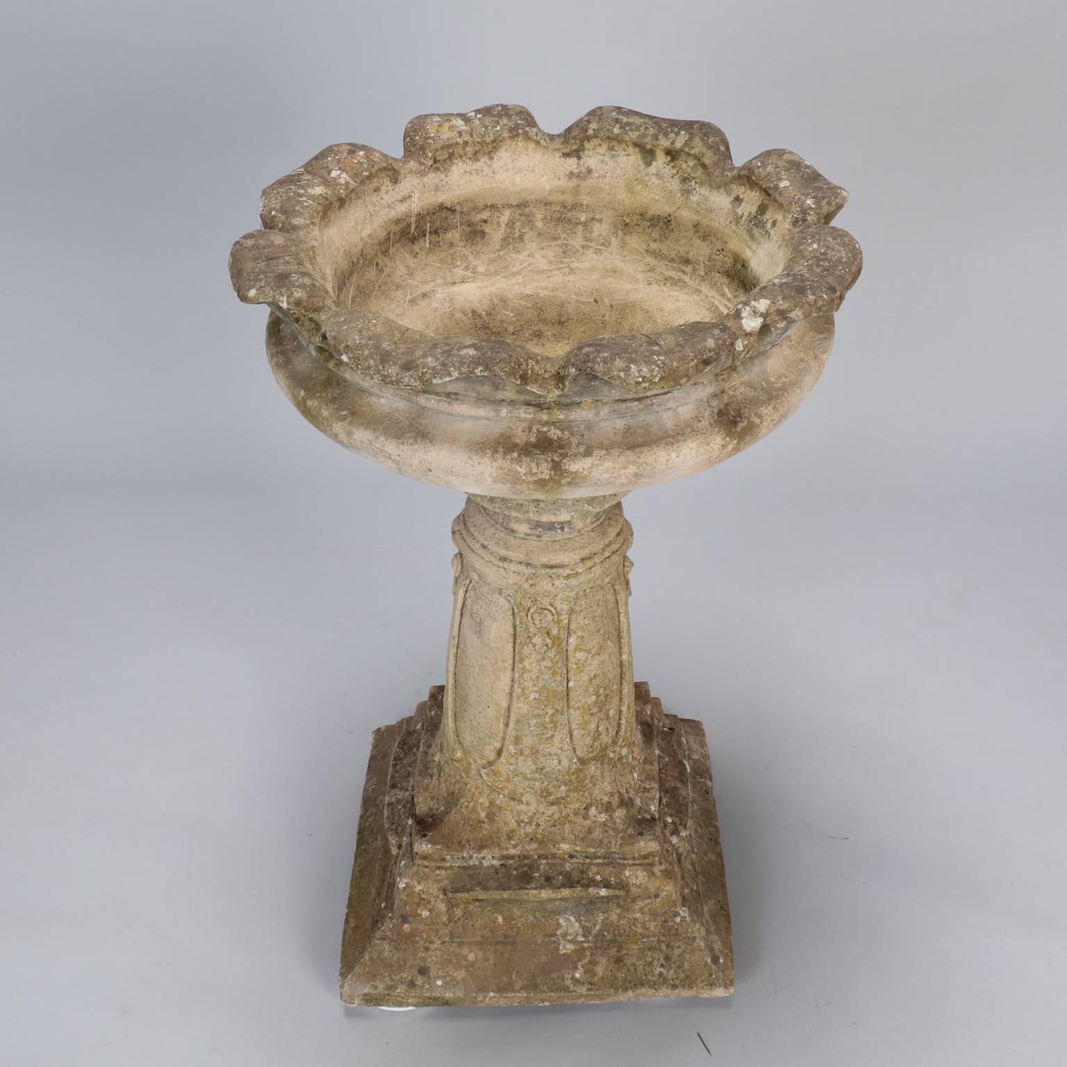 Found in England, this cement bird bath or planter dates from approximately 1900-1910.  Heavy cement base has a removable bowl with fluted edges. Nicely weathered. Some chipping/loss to corner of base and center column - see detail photos. Inner