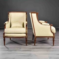 Early 20th Century French Carved and Gilded Mahogany Armchairs - Pair