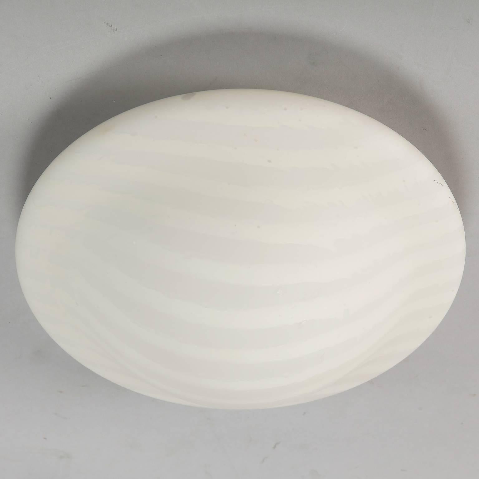 Round white on white striped satin glass flush mount light fixture attributed to German maker Peill and Putzler. New wiring for US electrical standards, circa 1950s.