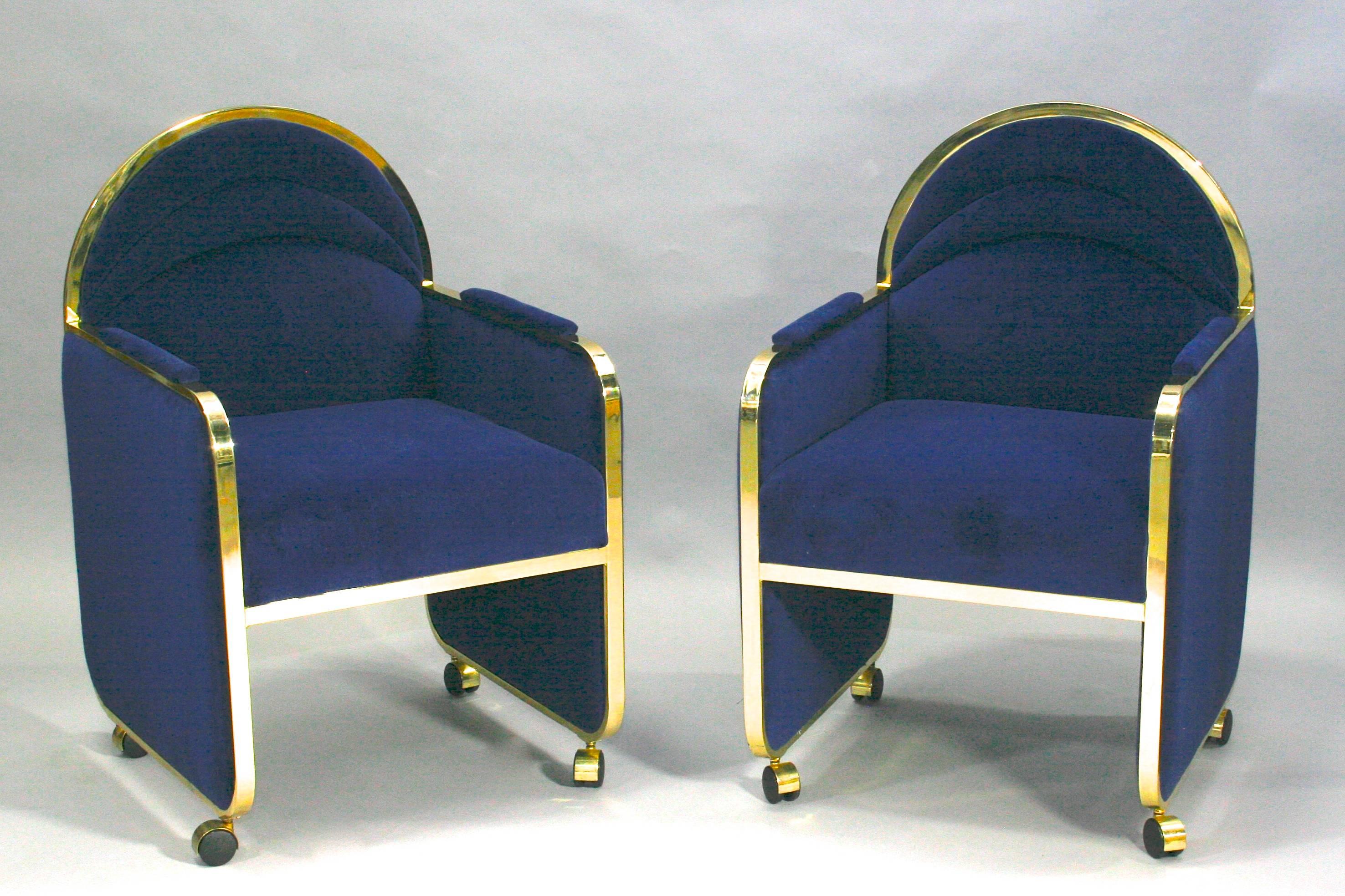 Pair of cube shaped club chairs in manner of Milo Baughman for Design Institute of America, circa late 1970s. Original DIA labels removed when these were reupholstered. Brass frame chairs with casters and new blue velvet upholstery. Sold and priced