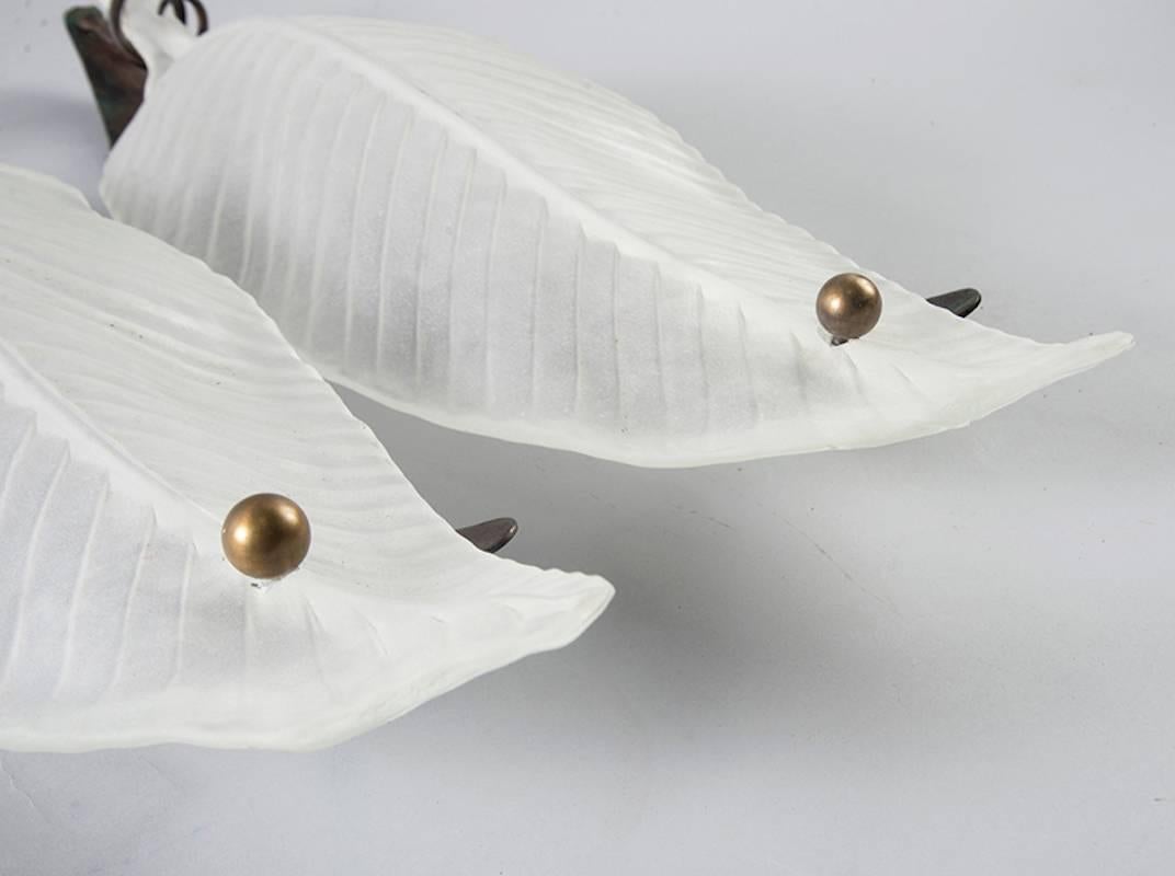 Pair of extra large handblown Murano glass leaf-form sconces, circa 1960s. Clear, frosted glass leaves set in hand-wrought iron frames. New wiring for US electrical standards. Sold and priced as a pair.