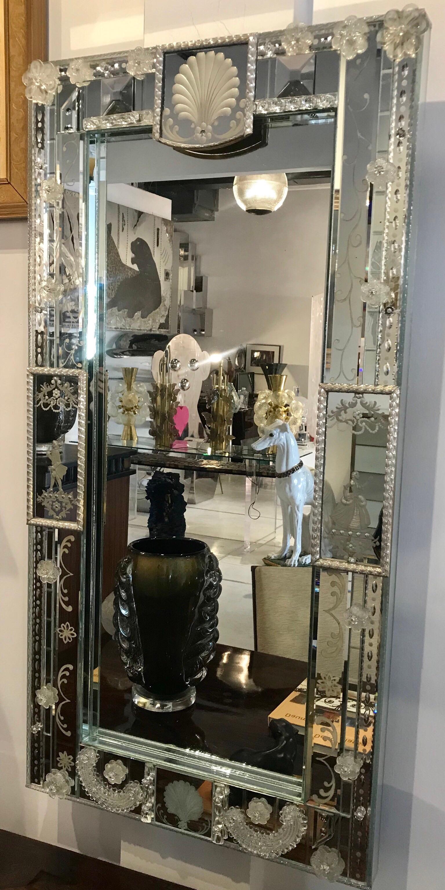 A very chic patchwork of mid century venetian mirror with floral venetian glass applications. Absolutely beautiful motifs and in fabulous condition.