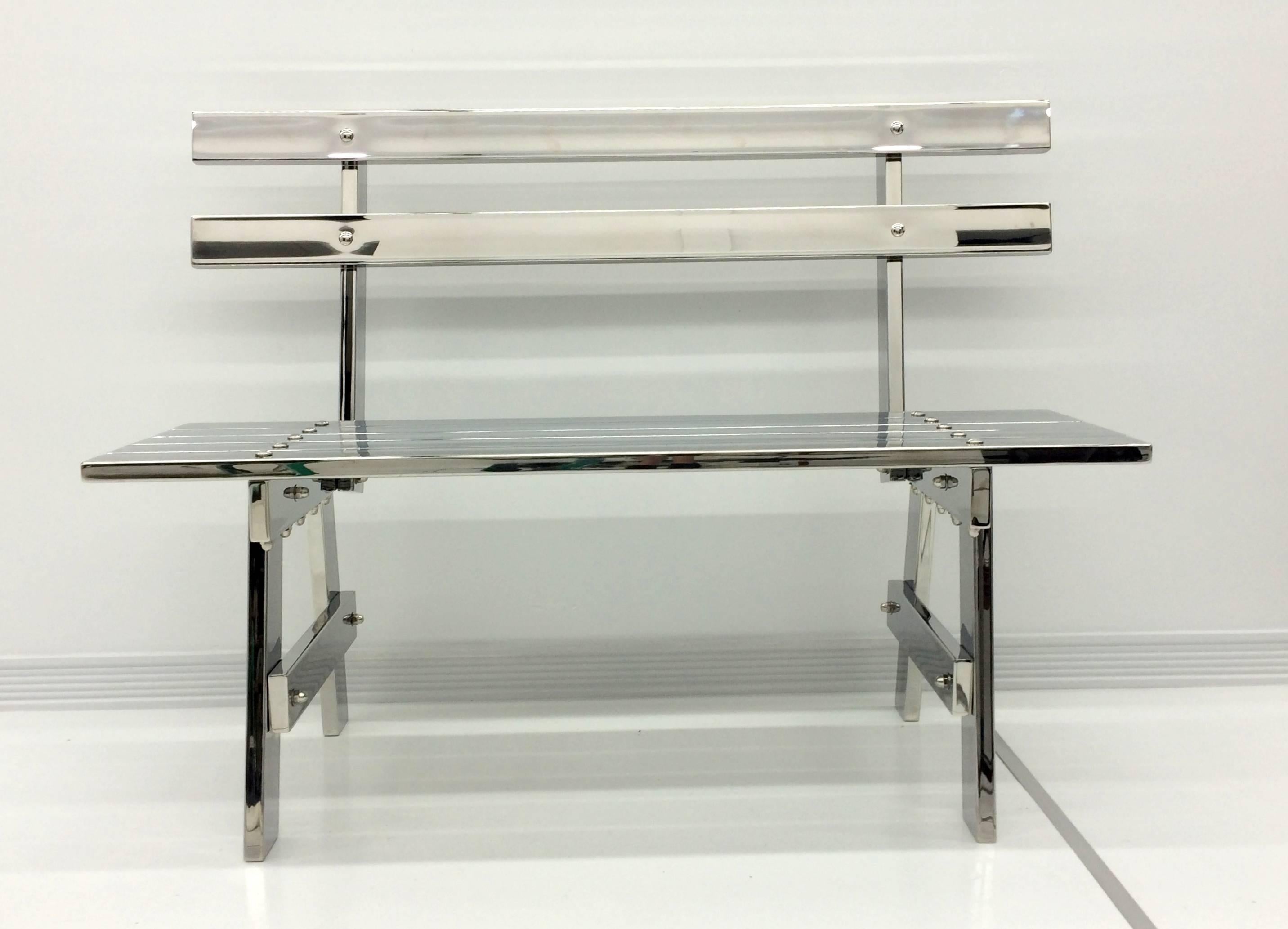 Sculptural modern mirror polished stainless steel park bench titled 