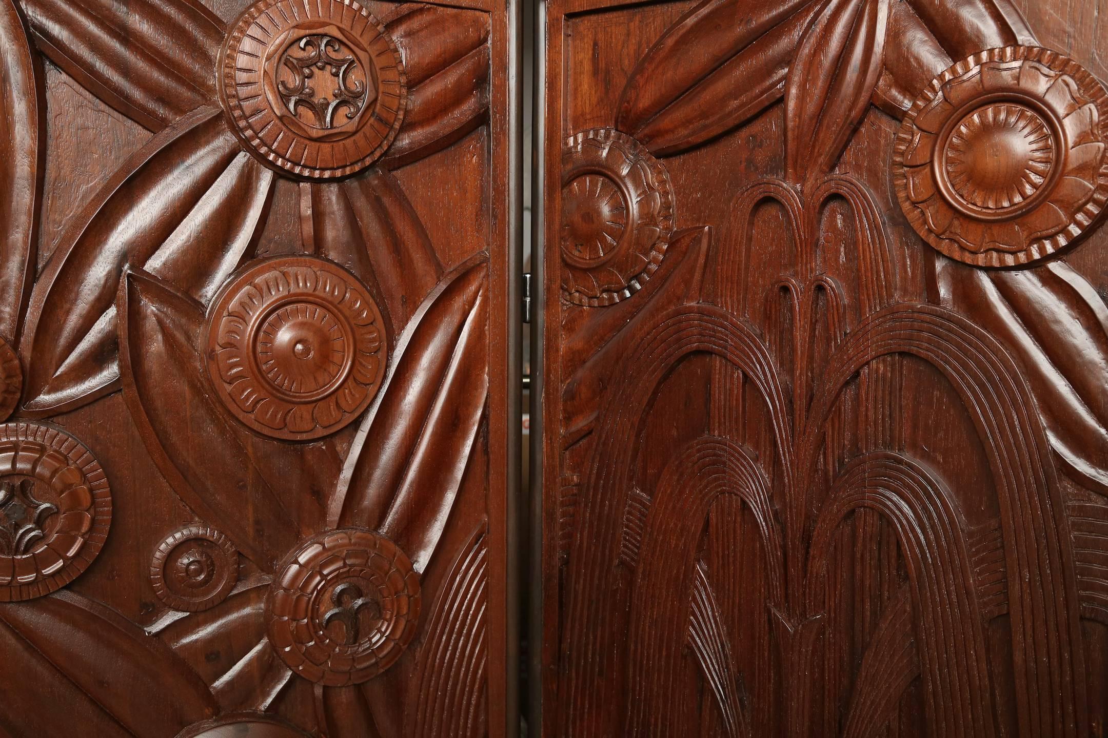 Sublime French Art Deco carved wood five-panel screen in the style of Edgar Brandt.
