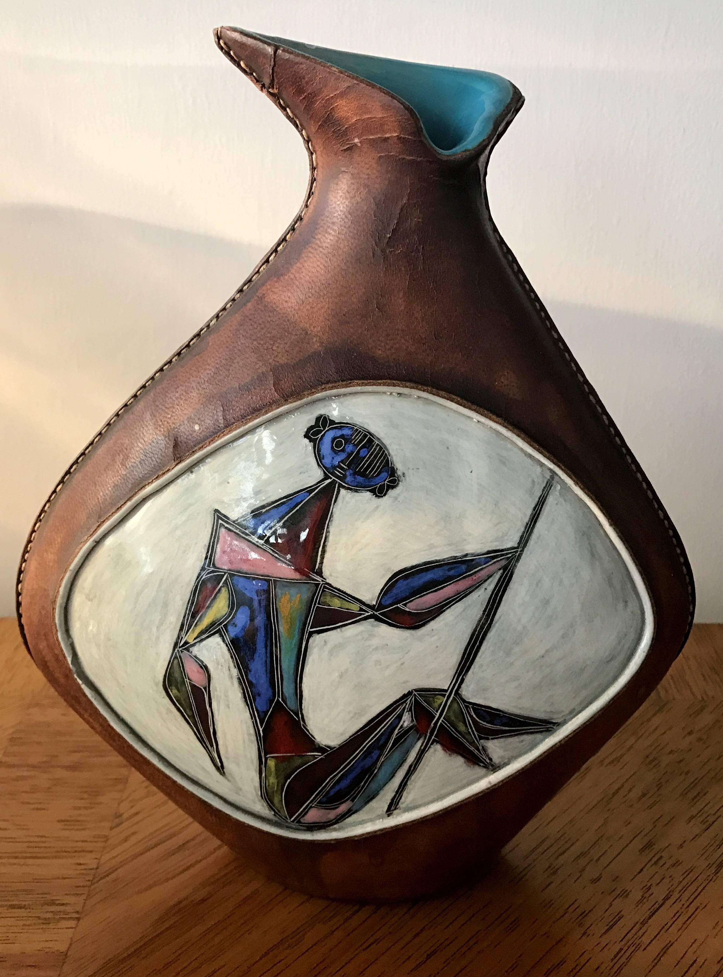 Signed Marcello Fantoni Italian glazed ceramic vase encased in Leather with Cubist warrior figure.