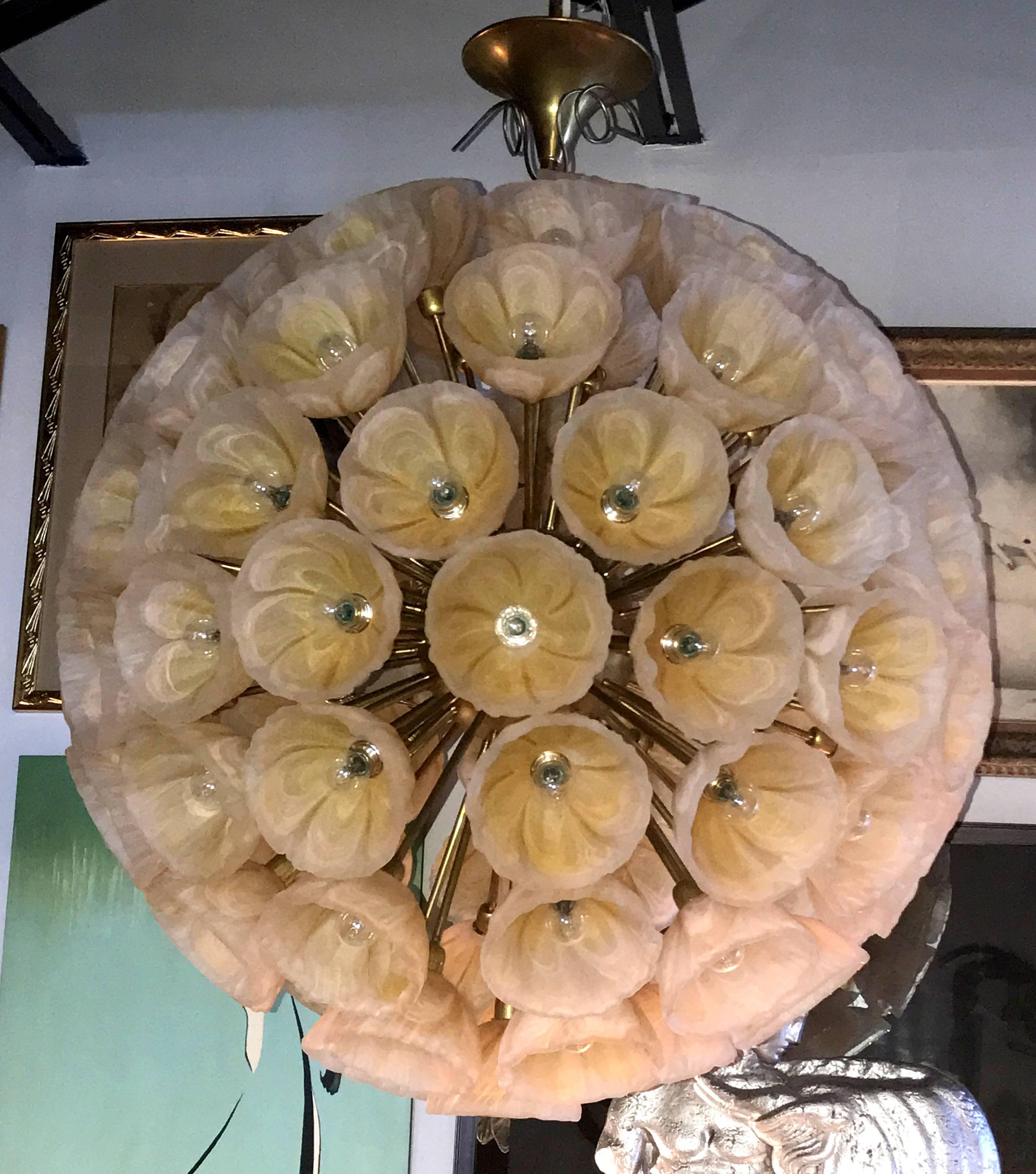 Large and spectacular chandelier of peach swirled Murano glass flowers on bronze stems and a bronze centre. The effect is sublime. The drop height can be shortened if necessary. The chandelier has European wiring.
