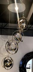 Pair of Brass, Stainless Steel and Lucite Armillary Sphere Chandeliers