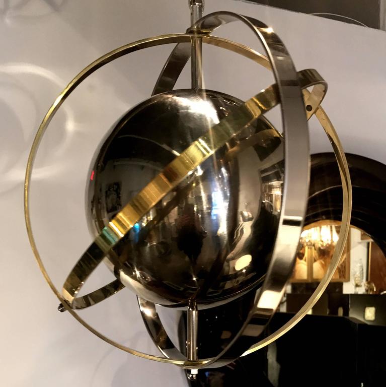 Pair of Brass, Stainless Steel and Lucite Armillary Sphere Chandeliers at 1stDibs