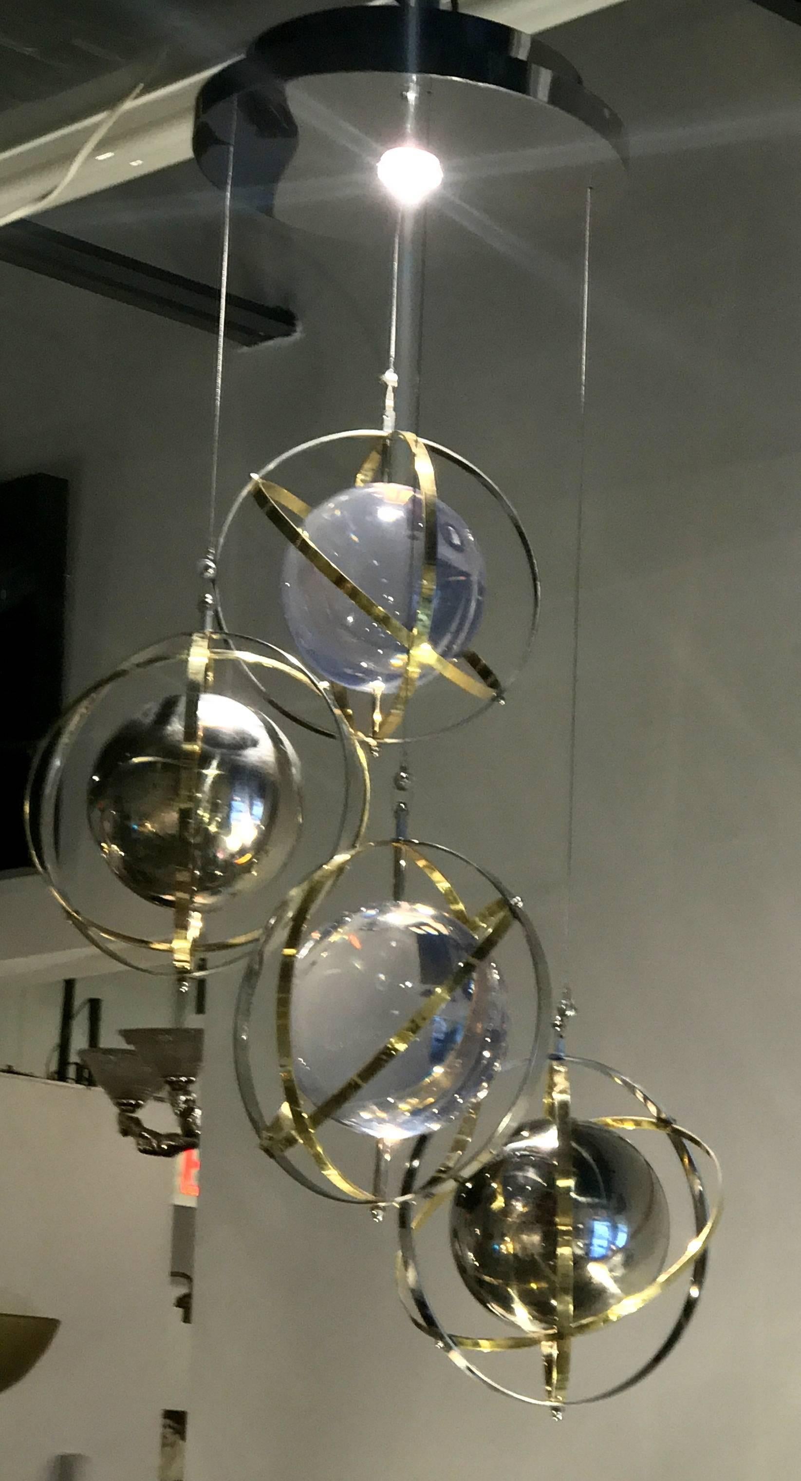 Mid-Century Modern Pair of Brass, Stainless Steel and Lucite Armillary Sphere Chandeliers