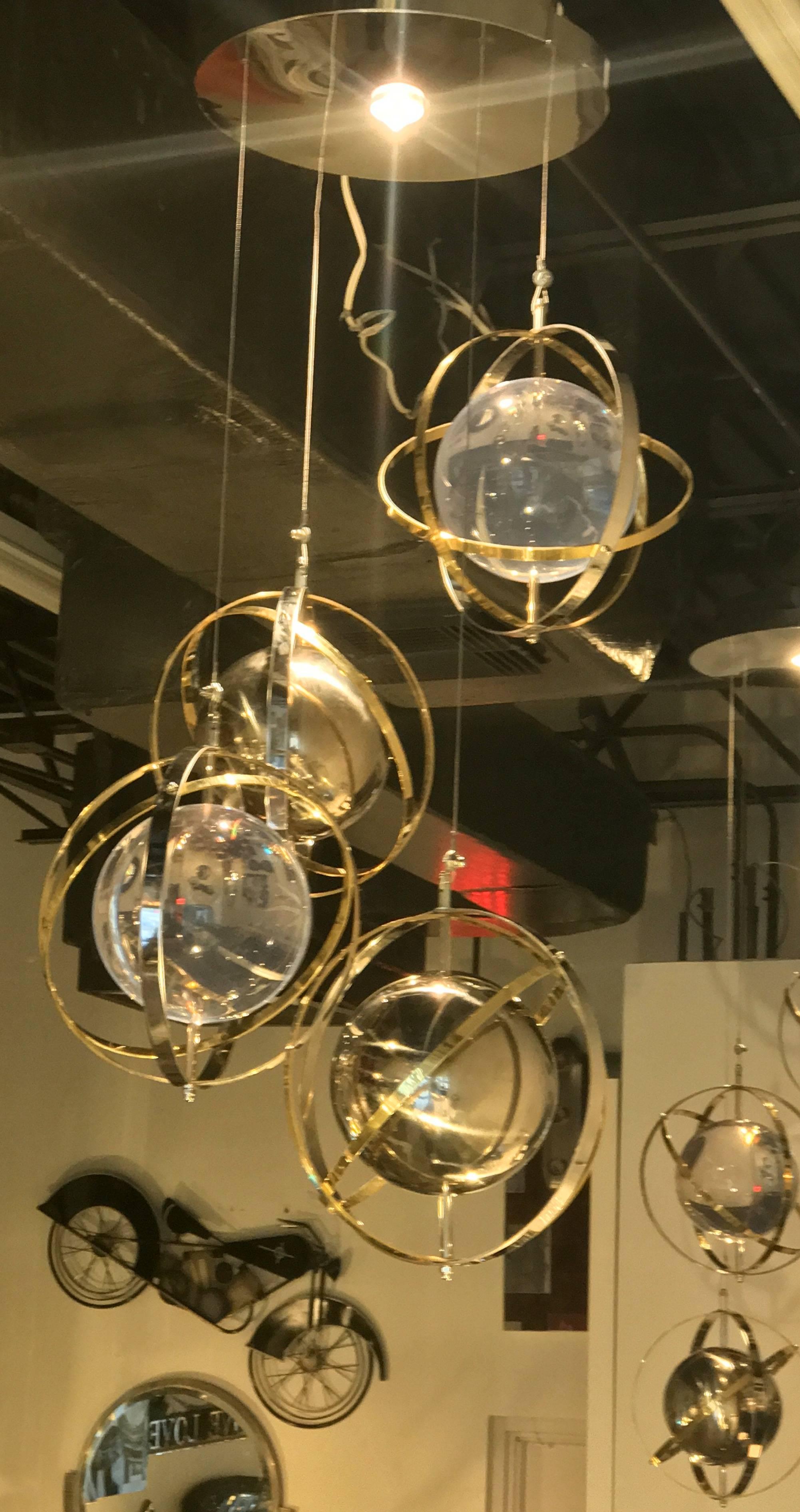 Italian Pair of Brass, Stainless Steel and Lucite Armillary Sphere Chandeliers