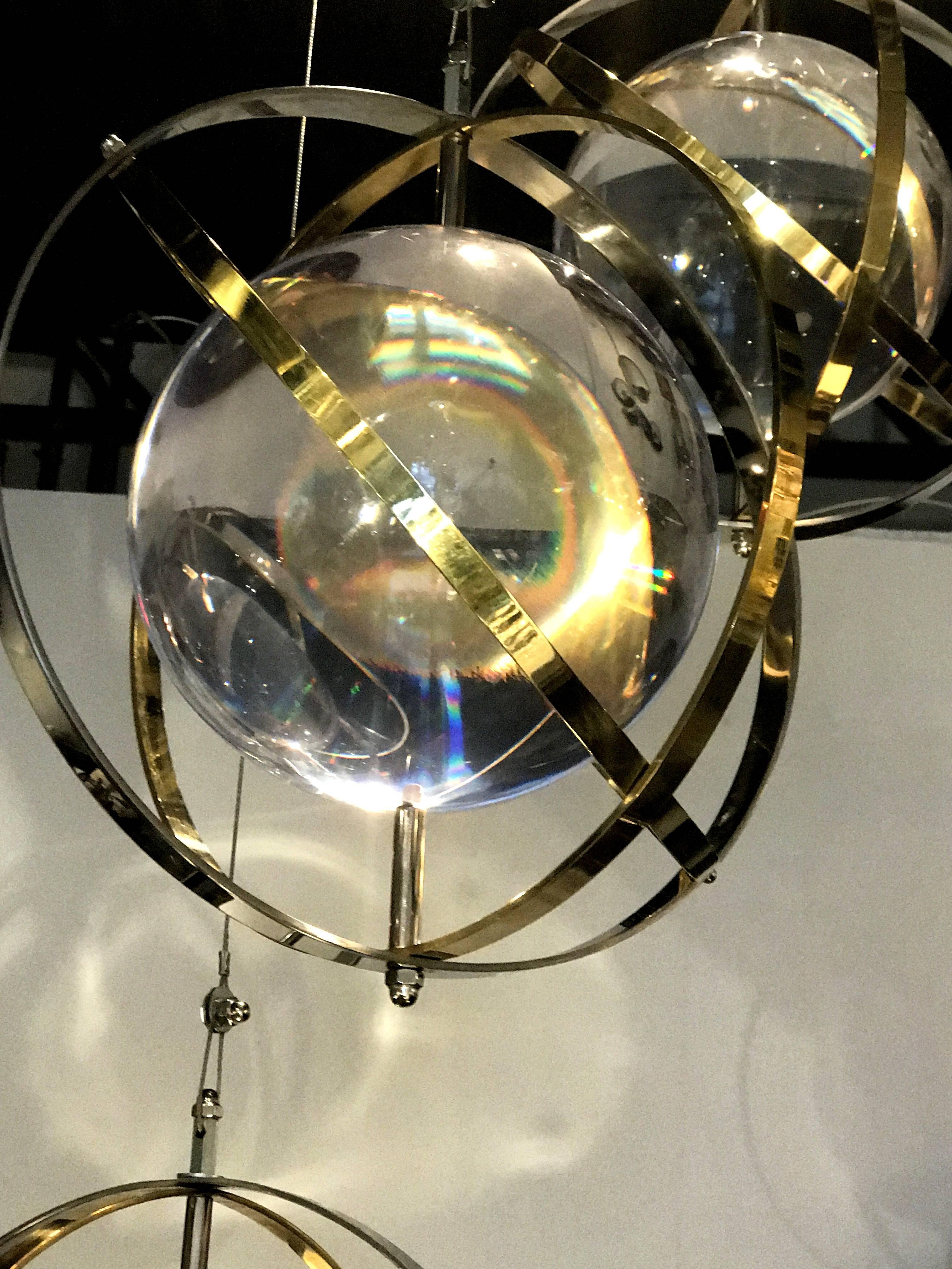 Pair of Brass, Stainless Steel and Lucite Armillary Sphere Chandeliers In Good Condition In Miami, FL