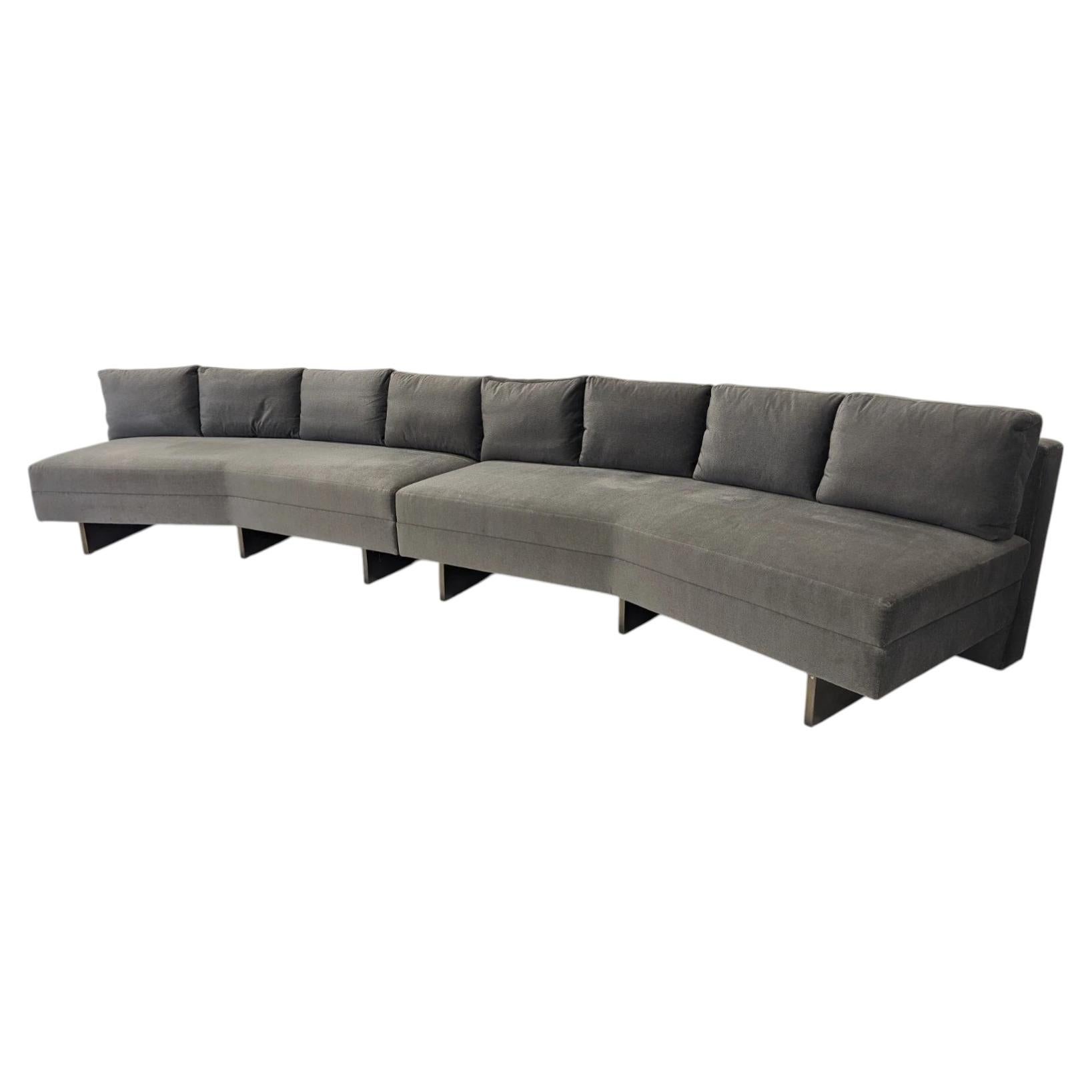 What is a curved sofa called?