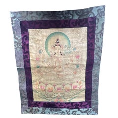 Thangka tibetana de Chenrezig pintada en dorado y con brocado de seda, de finales del siglo XX