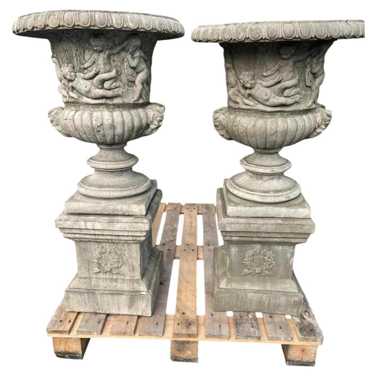 Pair of Large English Classical Stone Garden Urns with Cherub