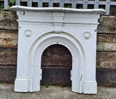 Large Victorian Cast Iron Arched Fireplace with Serpentine Mantel