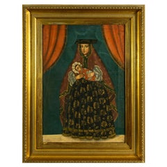 Peinture de l'école de Cuzco du XIXe siècle représentant la Vierge à l'Enfant, dans un cadre doré