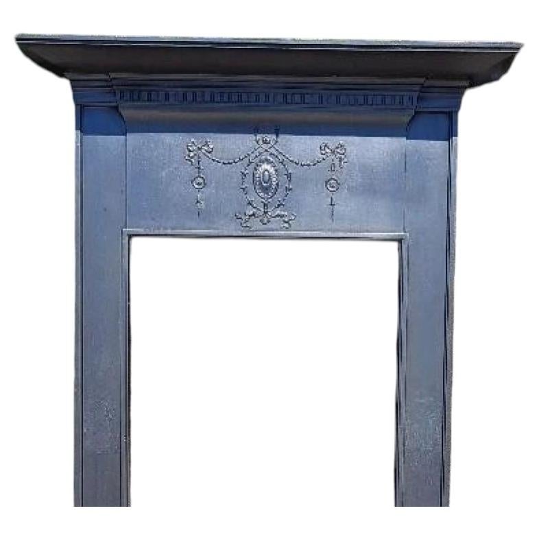 Antique Edwardian Cast Iron Mantel Surround with Classical Decoration For Sale