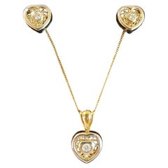 Ensemble pendentif et boucles d'oreilles en forme de cœur en or 18 carats et diamants
