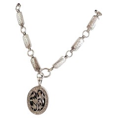 Antique Victorian Aesthetic Sterling Silver Chased Locket & Chain, circa 1880