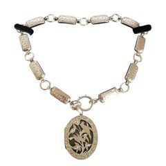 Antique Victorian Aesthetic Sterling Silver Chased Locket & Chain, circa 1880