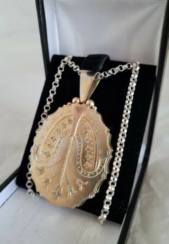 Victorian Aesthetic Sterling Silver Oval Locket & Chain, circa 1890