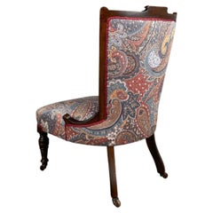 Edwardian Mahogany Nursing Chair with Original Casters and Paisley Upholstery